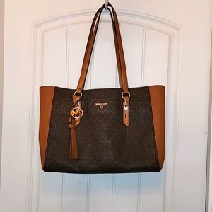 Michael Kors large 3 compartment purse. Over the shoulder.